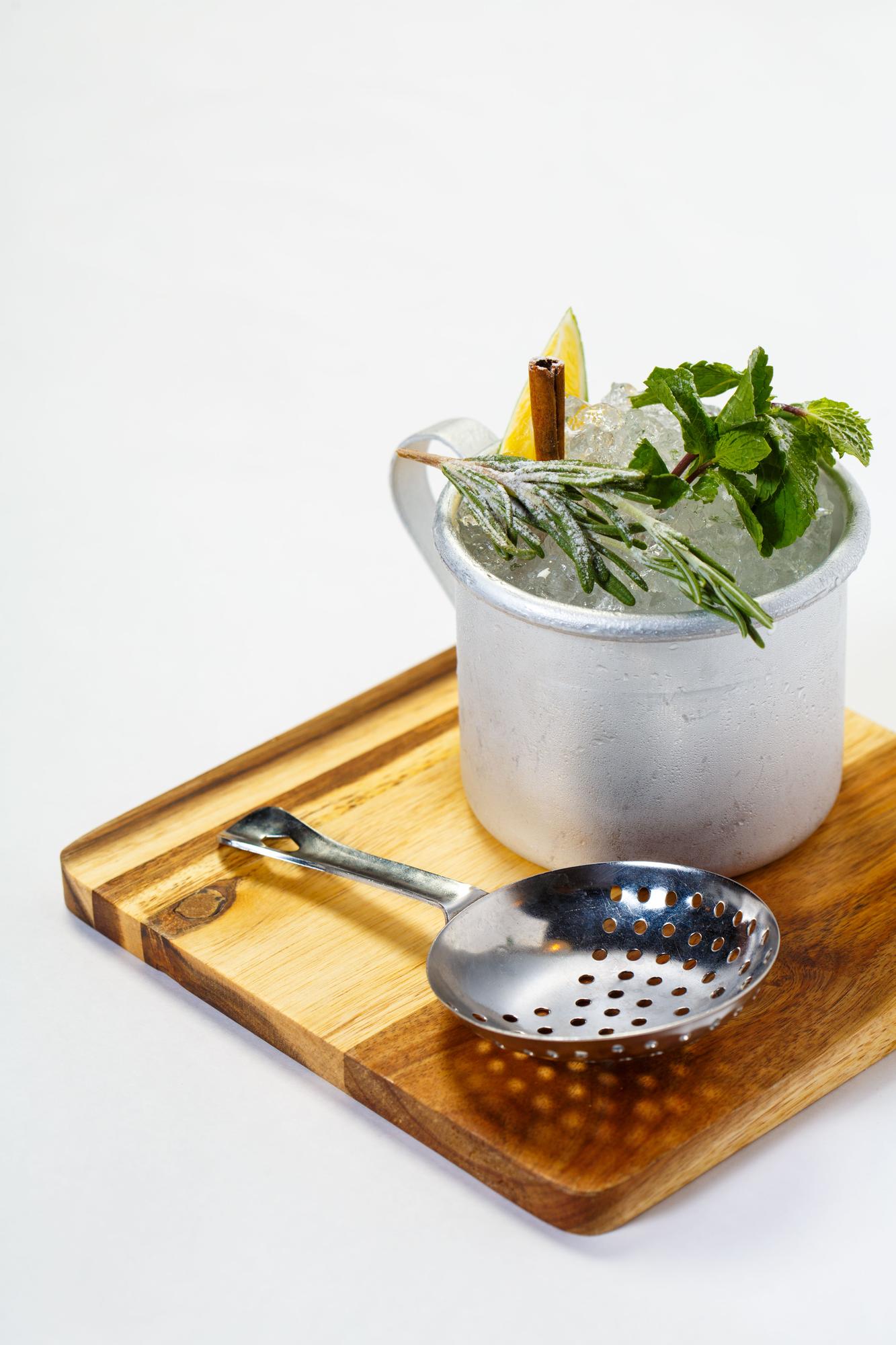 studio counter with cookware and herbs